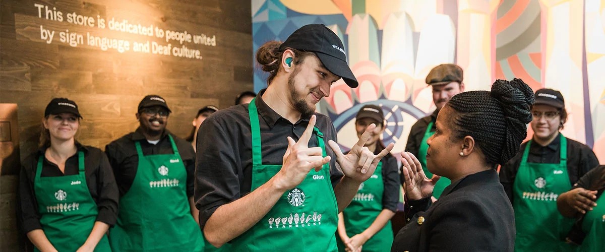 Starbucks employees training one another