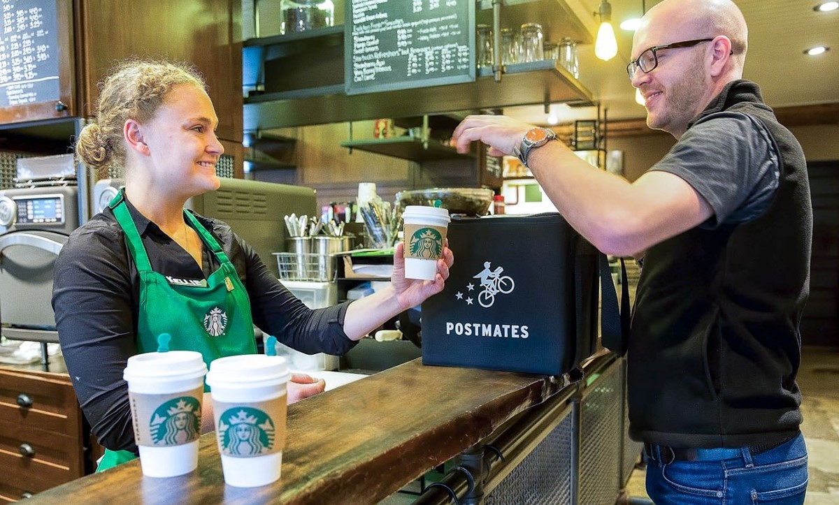 Starbucks Employee interacting with a customer